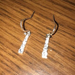 Silver hanging earrings.